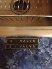 06-9101-c09990c Saleen Mustang 3-valve Badge