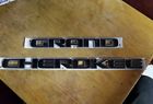 55112900aa Jeep Grand Cherokee Front Door Emblem Black Oem Used