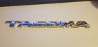 75670 75670- Toyota To Tacoma Emblem Oem Chrome Badge Logo Name
