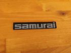 77811-83060 Suzuki Samurai Dash Emblem Jimny