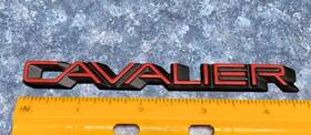 20351097 Chevrolet Small Cavalier Emblem Beveled Red/black Plastic Exc Condition