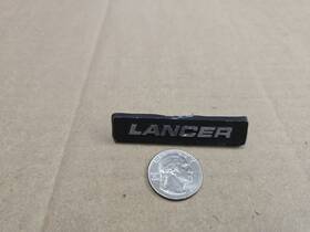 4311542 Dodge Oem Lancer Front Dashboard Dash Board Emblem Badge Logo Name Plate