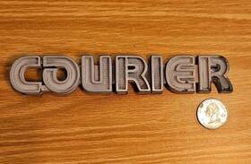 69-053 Ford 1978-1980 Courier Fender Emblem - Plastic With Pin As Removed 69 053