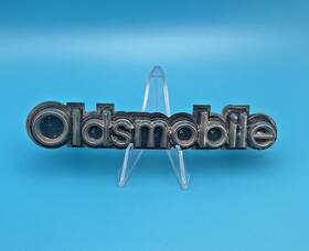 22522196 General Motors 1978-1979 Oldsmobile Front Grille Emblem Badge With Bracket Gm Oem 559183