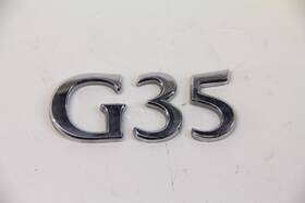 84894-am800 Infiniti G35 03-07 Coupe Emblem Logo For Trunk Deck Luggage Lid A56