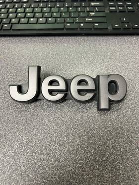 68348320ab Jeep 2019-23 Cherokee Inch Emblem Tailgate Grey Used Oem