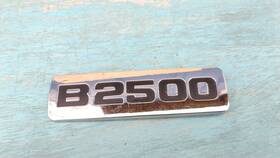 F87b-16b114-a Mazda B2500 Fender Emblem Badge Decal Logo Symbol Oem Genuine Original Factory