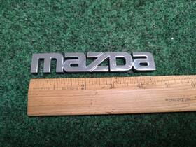 Gd7a-51-711 Mazda 1997-2002 626 Lx Chrome Rear Trunk Deck Lid Emblem Factory Oem 2s5