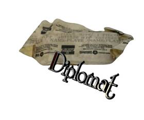 4017526 Mopar 1977-1983 Dodge Diplomat Fender Nameplate Emblem Nos