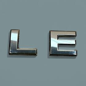 90896-7s100 Nissan Le Emblem Letters Badge Decal Logo Armada Titan Frontier Rear Oem Genuine