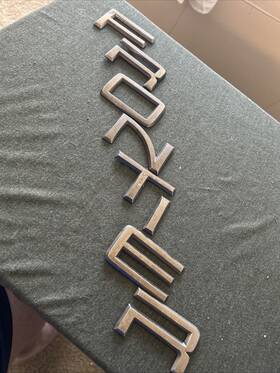 93494-9z500 Nissan 2001 - 2004 Frontier Rear Tail Gate Emblem Logo Badge Symbol Nameplate