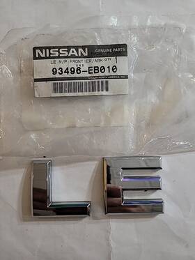 93496-eb010 Nissan 93496-eb010. Rear Emblem. Used Oem. Refurbished. 04/15 Armada/frontier