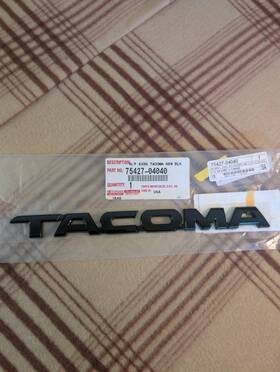 75427-04040 Toyota Tacoma 05-15 Black Door Side Emblem Genuine