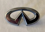 Htf 2000 Infiniti I30 Front Grille Emblem Tag Ornament W/ Both Mounting Pegs Oem. Fixed Price $25.00.
