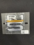 Rivian R1S Rear Emblem PT00879094A. Fixed Price $60.00.
