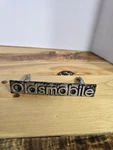 Oldsmobile Oem 1986-1989 Delta 88 Front Grille Emblem Badge Logo 22524390. Fixed Price $16.99.