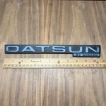 Datsun By Nissan Original Vintage Emblem Badge Oem Part # 76890 04W00. Fixed Price $27.00.