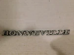 9614533 1971-72 Pontiac Bonneville Emblem. Fixed Price $30.00.