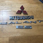 02-03 Mitsubishi Galant Es Emblem Rear Trunk Logo Red MR339344. Fixed Price $36.95.