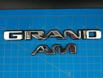 Pontiac Grand Chrome Emblem Badge Set Oem Trim Nameplate Vintage 1990S 2000S. Fixed Price $23.99.