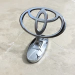 Toyota Front Hood Bonnet Emblem In Metal Adhesive Attachment. Fixed Price $18.99.