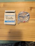 Mazda Emblem B25D51730B New. Fixed Price $10.00.