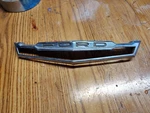 1960S Ford Hood Emblem Bezel C20B-16607B. Fixed Price $35.00.