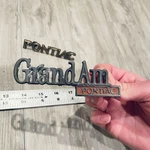 Grand Pontiac Trunk Emblem Vintage 1973-1975 #9657700 Nameplate Badge Set. Fixed Price $16.99.