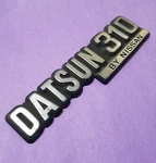 BIN9 Used 1979 1980 Datsun 310 By Nissan Gx? Emblem Badge Plastic. Fixed Price $99.99.