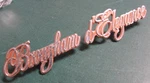 Pair Cadillac Brougham D'elegance Script Logo Emblems - Orange 20082676 20082807. Fixed Price $29.99.