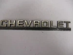 Chevrolet" # 1405225 Emblem Badge Script Trim Metal Gm. Fixed Price $38.00.