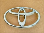 Genuine Toyota Land Cruiser Front Grille Emblem 1995-2002. Fixed Price $46.00.