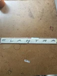 New 2019-2020 Hyundai Elantra Rear Nameplate Emblem Oem 86315 F2AA0 / Su 2205. Fixed Price $44.50.