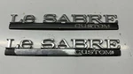 Pair Used Oem Gm 00-05 Buick Lesabre Rear Quarter Panel Emblems Part# 25648731. Fixed Price $12.95.