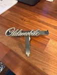 Vintage Oldsmobile Script Emblem Badge. Fixed Price $19.99.