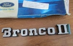 Nos 1984-1990 Ford Bronco Ii Fender Tailgate Emblem Oem E7TZ16098K. Fixed Price $65.00.