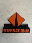 1990-1999 International Hood Side Emblem Fits 4200, 4700, 4900, 8100 # 1652253C1. Fixed Price $49.00.
