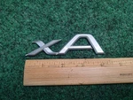 2004-2006 Scion Xa Emblem Logo Badge Symbol Rear Tailgate Trunk Silver Gray 3S7. Fixed Price $15.99.