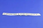 Genuine Mopar Front Door Nameplate 68236146AA. Fixed Price $68.49.