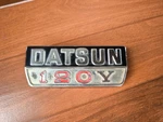 Datsun Sunny 120Y B210 1974-1977 Rear Emblem Badge Genuine. Fixed Price $50.00.