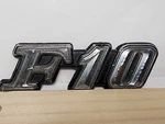 Datsun F10 Emblem Ornament Logo Plate Script Badge Oem 78802 M6900. Fixed Price $12.99.