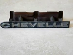 Chevrolet" Chevelle Grille Emblem Badge Script Trim Metal PRT#328996. Fixed Price $68.00.