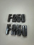 (2) Vintage 1970'S Ford F-250 Front Fender Emblem Badge KBC-40083 D4TB-16702-BA. Fixed Price $24.99.
