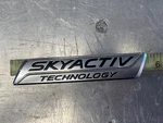 Mazda Skyactiv Technology Emblem Symbol Badge Oem KD53-51771 Abs. Fixed Price $14.00.