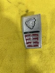 1964 Mercury Comet Caliente Monterey Trunk Lid Emblem. Fixed Price $80.00.