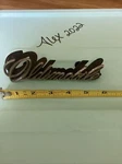 Vintage Oldsmobile Chrome Metal Emblem Badge Nameplate Logo Cursive Script Pins. Fixed Price $30.00.