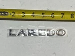 Genuine Oem Mopar Jeep 55157303AF Rear "laredo" Nameplate 05-15 Grand Cherokee. Fixed Price $48.12.