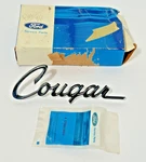 Nos 1974 Mercury Cougar Emblem Trim Scrip Ford# D4WY-1608-A. Fixed Price $45.00.