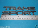 Pontiac Trans Sport Black Gray Front Side Door Emblem Nameplate Badge Set. Fixed Price $13.00.