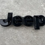 2014-2022 Jeep Grand Cherokee Matte Black Tailgate Emblem Mopar Oem 5UY60DX8AA. Fixed Price $35.00.